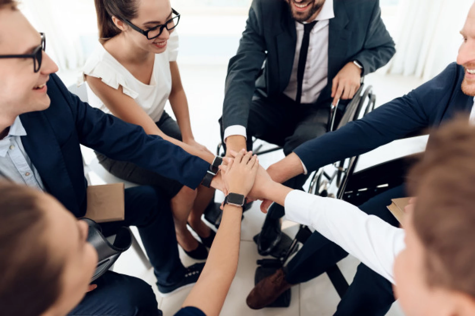 disabled-people-put-hands-together_85574-6929