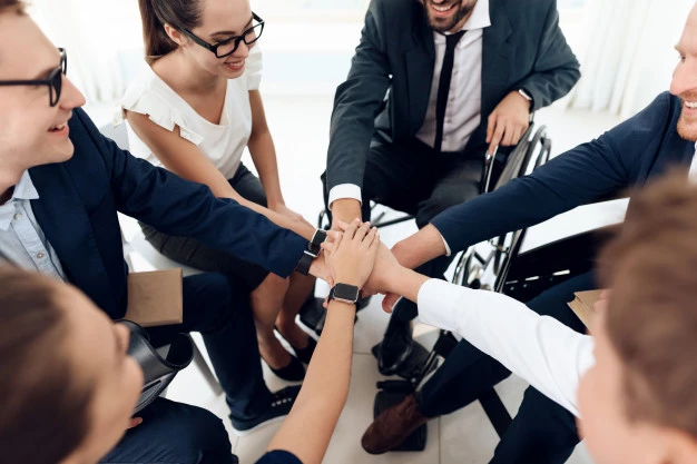 disabled-people-put-hands-together_85574-6929